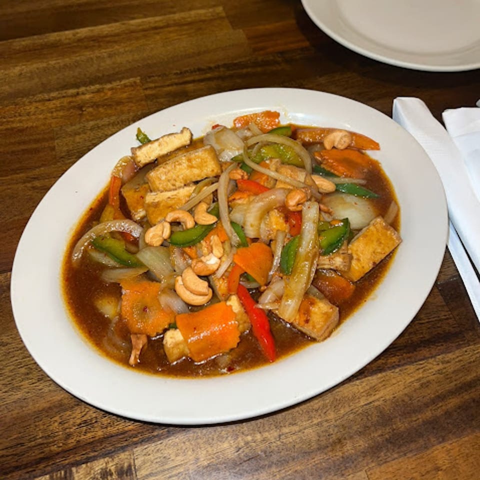 Thai Chili Asian Bistro's stir-fried tofu with cashews, onions, carrots, and bell peppers in a savory sauce.